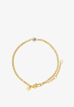 Bracelet en chaîne dorée avec un centre en pierre précieuse ronde et transparente, doté d'un fermoir en homard et d'une chaîne de longueur ajustable. Texture lisse.