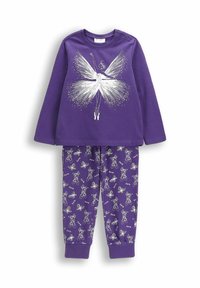 Fioletowa bluzka z długim rękawem z białą grafiką wróżki, połączona z fioletowymi spodniami zaprezentowanymi z powtarzającymi się ilustracjami białej wróżki. Oba wykonane są z bawełny.