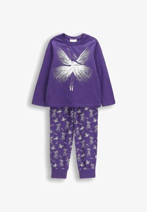 Fioletowa bluzka z długim rękawem z białą grafiką wróżki, połączona z fioletowymi spodniami zaprezentowanymi z powtarzającymi się ilustracjami białej wróżki. Oba wykonane są z bawełny.