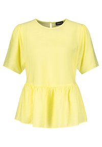 Top peplum giallo realizzato in un tessuto morbido, con maniche corte, collo rotondo e un'apertura a chiave sul retro. Texture liscia.