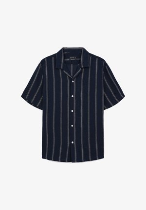Chemise à manches courtes navy avec des rayures verticales blanches, un col cranté et une fermeture à boutons à l'avant. Fabriquée en tissu texturé.