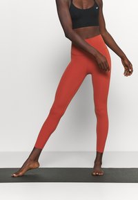 Nike Performance Leggings - metallic red