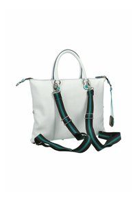 Sac à main en cuir blanc avec double poignées, bandoulière réglable à rayures noires et teal, fermeture éclair et accents décoratifs en métal.