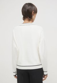 Calliope Strickjacke - bianco