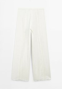 Szerokie spodnie z lekkiej, teksturowanej tkaniny w odcieniu off-white, z pionowymi detalami szycia i postrzępionymi brzegami.