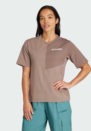 Brown short-sleeve t-shirt with a textured design, featuring a triangular accent and TERREX logo on the front. Soft, breathable material.