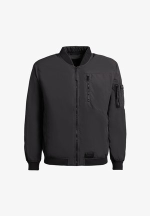 Zwarte bomberjack met ritssluiting aan de voorkant, met ritsen afgesloten borst- en mouwzakken, geribbelde boorden en tailleband.