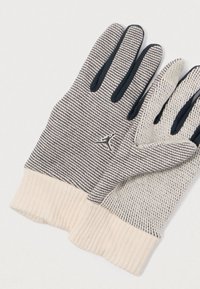 Megzti pirštinės su dryžuotu raštu pilkos ir kreminės spalvų, juodais galiukais ir kreminiu suploto rankogaliu. Priedo yra mažas logotipo detalė.