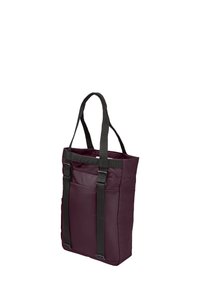 Burgundy nylon tote bag with two black straps, a structured shape, and a front pocket. Smooth texture with a minimalistic design.