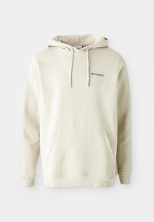 Crèmefarget hettegenser laget av myk stoff med en frontlomme av kangaroo-type, snøring i hette, og en liten brodert logo på brystet.