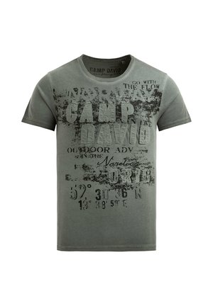 Green short-sleeve T-shirt with distressed black text "CAMP DAVID," coordinates, and phrases like "GO WITH THE FLOW" on front.