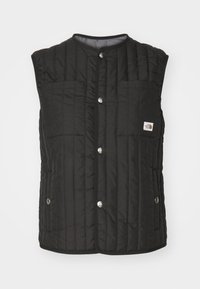 Svart pufferväst med ett quiltat mönster, tryckknappar och en bröstficka. Tillverkad av lätt tyg, med rundad halsringning och utan ärmar.