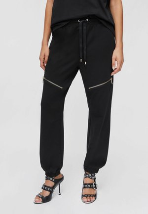 MIT REISSVERSCHLUSS - Pantalones deportivos - black