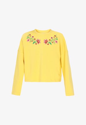 Gelbes Sweatshirt mit langen Ärmeln und Rundhalsausschnitt, das auf der Vorderseite mit floralem Stickerei in Pink, Rot und Grün verziert ist. Aus weichem Baumwollmaterial.