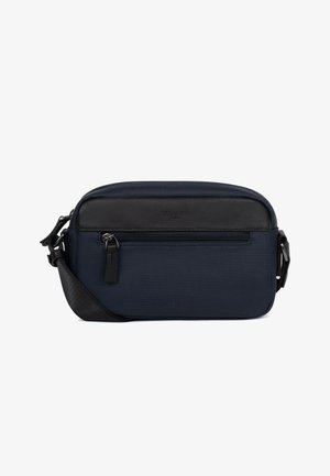 Navy blue rectangular crossbody bag with black leather trim, front zip pocket, and adjustable black strap on white background.