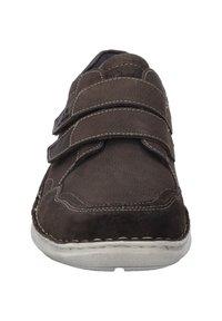 Brown suede shoe with two Velcro straps, rounded toe, and white rubber sole. Features contrasting stitching along the edges.