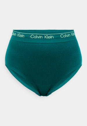 Petroleumsfargede høyt midjetruser med en myk tekstur, med en bred elastisk midjebånd med "Calvin Klein"-logo i kontrasterende grønn.