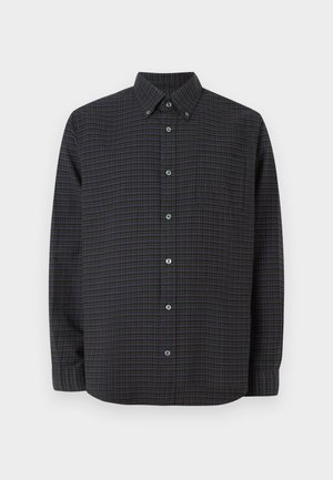 Mustat napitettavat paita, jossa on tummanvihreä ja purppuranvärinen ruutukuosi. Edessä on rintatasku ja pyöreä kaulus. Valmistettu kudotusta kankaasta.