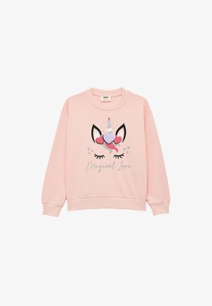 Sudadera rosa con un diseño de unicornio, corazones y un cuerno en espiral. El texto debajo dice "Amor Mágico". Tejido suave, corte relajado, mangas largas.