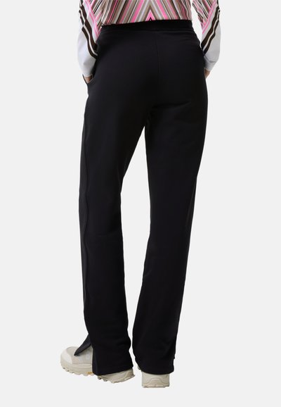 Black athletic pants with a straight fit, elastic waistband, and side pockets. Made from soft fabric, featuring minimal stitching details.