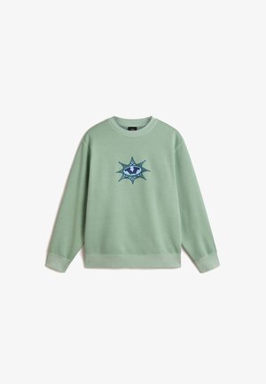 Light green sweatshirt with a round neckline, cuffed long sleeves, and a central graphic design featuring a star-like shape in blue and white.