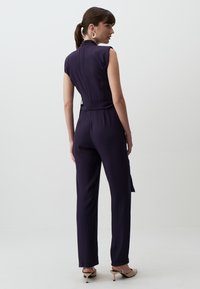 Jimmy Key V-NECK BELTED STYLISH WOVEN JUMPSUIT - Jumpsuit - dark blue