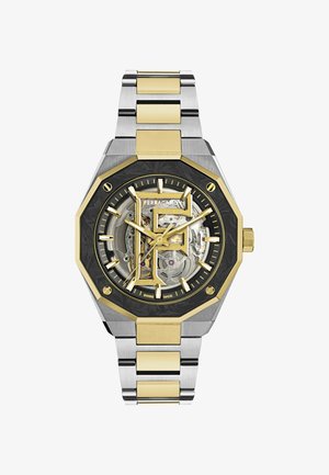 Reloj de pulsera metálico bicolor con eslabones de oro y plata, bisel octagonal negro y dorado, y esfera esqueletizada que muestra los engranajes interiores y el logo de "Ferragamo".