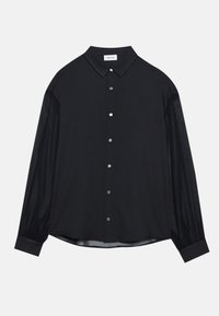 Chemise noire à manches longues avec boutons, manches semi-transparentes et col pointu, posée à plat sur un fond blanc.