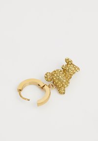 Orecchino a cerchio in oro con un charm a forma di orso impreziosito da piccole pietre gialle scintillanti. Il ganci è progettato con cerniera per un facile utilizzo.
