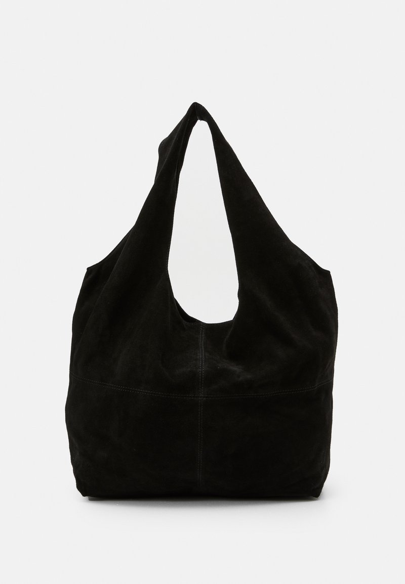 Black suede shoulder bag featuring a slouchy design, a wide, curved strap, and a seamless appearance with minimal stitching.