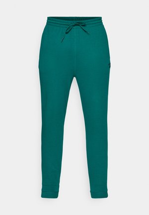 Türkise Sweatpants aus weichem Stoff, mit einem Zugverschlussbund, schmal zulaufenden Beinen und gerippten Bündchen. Minimalistisches Design ohne Muster.