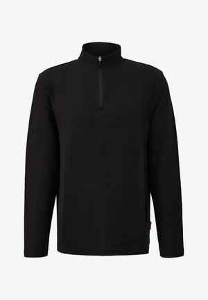 Schwarzer Pullover mit langen Ärmeln, hohem Kragen und einem Viertel-Zip-Verschluss. Gerippte Textur mit einem seitlichen Etikett-Detail. Funktionales und minimales Design.