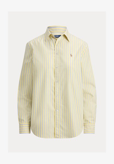 Κίτρινο πουκάμισο με ρίγες που κουμπώνει, με μπλε ρίγες, μακριά μανίκια, γιακά και μικρό κεντημένο λογότυπο στο αριστερό στήθος.