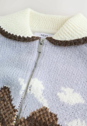 Knit zip-up sweater in light blue with cream collar, brown accents, and cloud patterns. Features a textured finish and silver zipper.