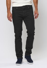 Slim-fit zwarte jeans van denim, met een klassiek vijf-pocket ontwerp, subtiele stiksels en een lichte stretch voor comfort.