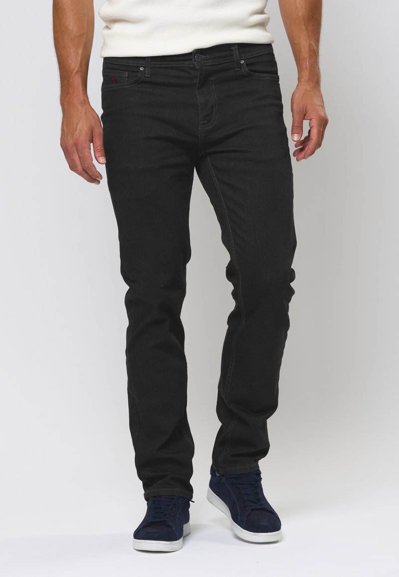 Slim-fit zwarte jeans van denim, met een klassiek vijf-pocket ontwerp, subtiele stiksels en een lichte stretch voor comfort.