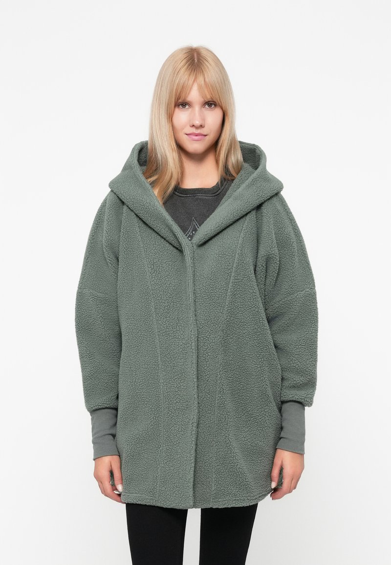 Strukturierte, übergroße grüne Fleecejacke mit Kapuze, Vorderverschluss und kontrastierenden Bündchen. Sie bietet ein gemütliches, weiches Gefühl und eine lockere Passform.
