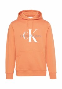 Orange hoodie made of soft fabric, featuring a front kangaroo pocket, drawstring hood, and white printed logo: "CK Calvin Klein Jeans."