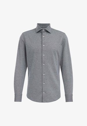 Harmaa pitkähihaisen paidan, jossa on kauluksellinen pääntie. Paita on valmistettu teksturoidusta kankaasta ja siinä on napitus. Hihansuut ovat napitetut ja paidassa on muotoiltu istuvuus.