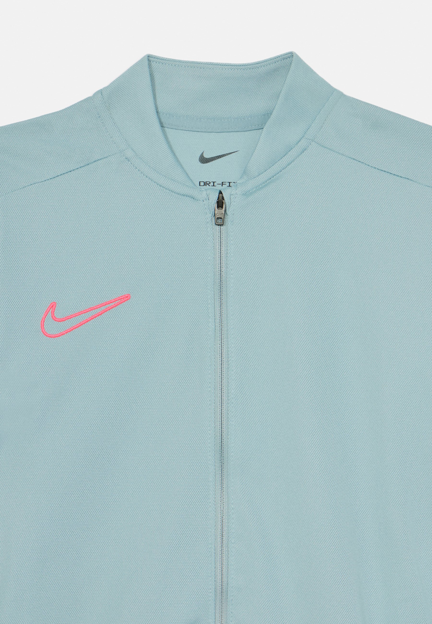 grey and pink nike tracksuit