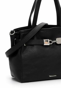 Black leather handbag with dual handles and a detachable strap. Features silver hardware and a prominent logo detail on the front.