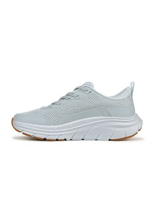 Gray athletic shoe with a textured mesh upper, padded collar, and a thick rubber sole, featuring a contrasting gum sole and lace-up design.
