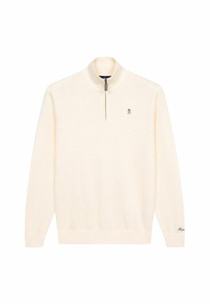 Suéter de color crema con un cuello alto, cierre de media cremallera y puños acanalados. Presenta un pequeño logo en el pecho y una tela texturizada.