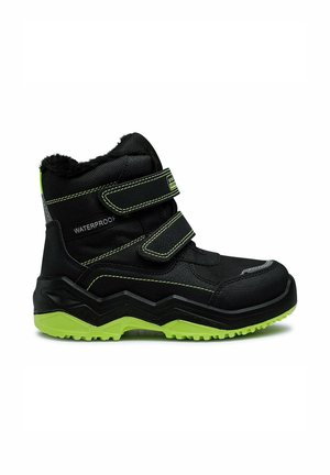 Black waterproof winter boot with green sole, two velcro straps, and fleece lining, designed for outdoor cold weather use.