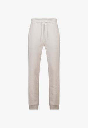 Lichtbeige joggingbroek gemaakt van zacht materiaal, voorzien van een elastische tailleband met verstelbare trekkoorden en geribbelde manchetten.