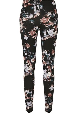 Svarte leggings med et blomsterdesign i nyanser av rosa, hvit og grønn. Glatt, elastisk stoff med en tettsittende design og uten fremtredende sømmer.