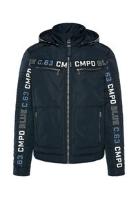 Navy blue jacket with a zip closure, two zippered pockets, padded shoulders, and printed branding on sleeves. Smooth, lightweight material.