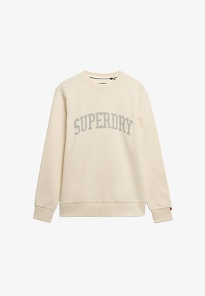 Sudadera color crema con texto "SUPERDRY" en gris. Manga larga, escote redondeado, puños y dobladillo acanalados. Fabricada con tela suave.