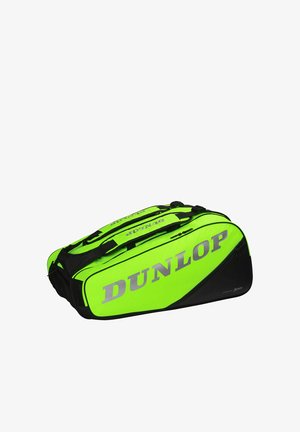 Bolsa deportiva Dunlop en verde brillante y negro con asas dobles, gran logo y varios compartimentos con cremallera.