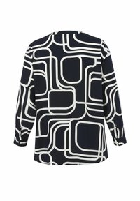 Marineblauw blouson met een abstract wit geometrisch patroon, lange mouwen, een ronde halslijn en knopenaccenten op de manchetten.